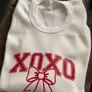 White XOXO Sweater with Red Bow Design